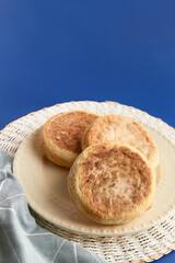 Bolo de caco. Traditional portuguese bread on blue a background