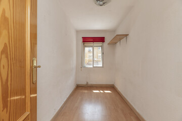 Empty room of an apartment with laminate flooring