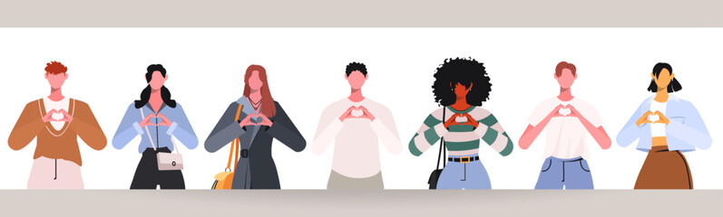 Group of young, modern people standing together and forming a heart shape with their hands. This represents team cooperation, partnership, and community. Concept of support, trust, friendship.