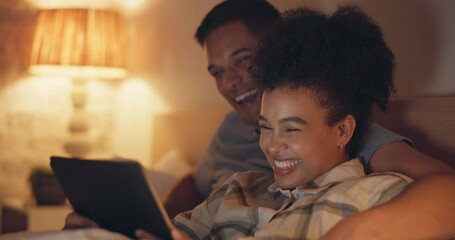 Tablet, funny and couple in bedroom at night, streaming comedy movie or video. Technology, happy man and woman laughing at meme, watch film or social media on internet, website or app on bed in home. - Powered by Adobe