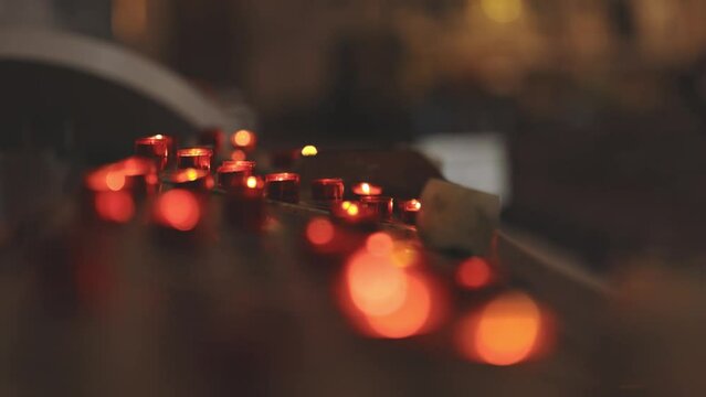 Red blurry candles in church - bokeh effect