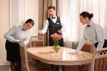 Group of people attending professional butler courses in hotel