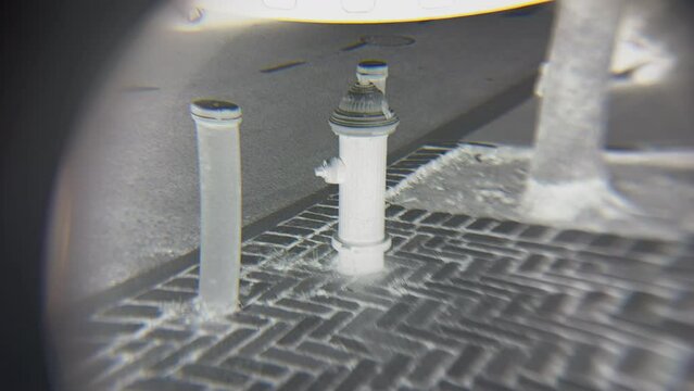 POV Examining Film Negative On Light Box Through Loupe