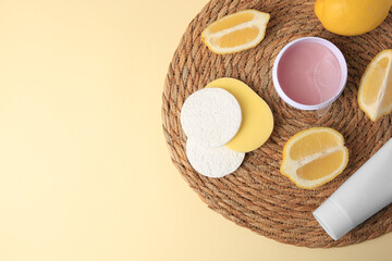 Lemon face wash. Fresh citrus fruits and personal care products on beige background, top view with space for text