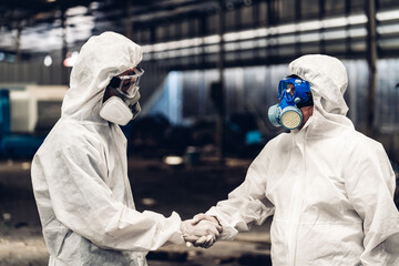Scientist wear Chemical protection suit check danger chemical, working at dangerous zone in Red and...