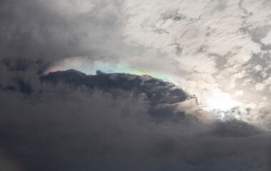 Fire Rainbow in the sky with clouds and rainclouds as background