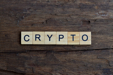 crypto text on wooden square, business quotes