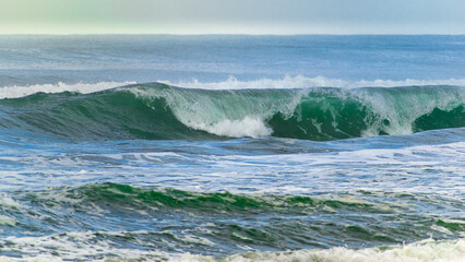 waves breaking on the beach
