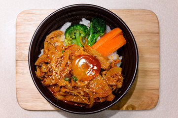 Japanese rice bowl or donburi topped with Pickled Egg Yolk in Soy Sauce