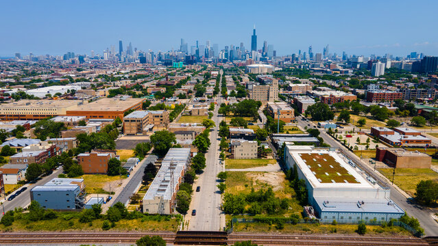 aerial overhead drone view of a Chicago urban neighborhood during the afternoon .  the residential area is has colorful buildings great for a background
