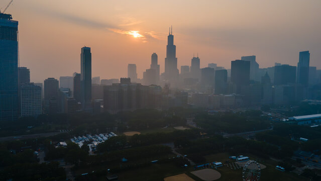 aerial drone view of the of Chicago  during a time when the pollution levels in the air are toxic and not safe for citizens. the wild fires from Canada are the cause of the environmental hazard 