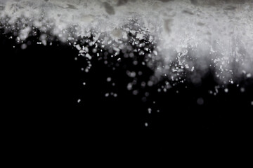 Tapioca starch flour fly explosion, White powder tapioca starch fall down in air. Seasoning flour powder is element material. Eyeshadow crush make up. Black background Isolated selective focus blur