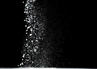 Tapioca starch flour fly explosion, White powder tapioca starch fall down in air. Seasoning flour powder is element material. Eyeshadow crush make up. Black background Isolated selective focus blur