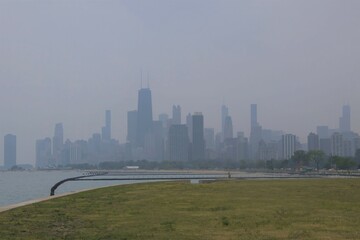 Chicago skyline is obscured at midday by smoke from Canadian wildfires.