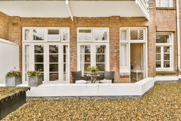 a brick house with white trim around the front door and windows that look like they'remeded from...