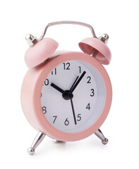 Pink alarm clock on white background