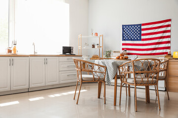 Interior of stylish kitchen with hanging USA flag