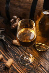 Glass of exquisite wine on wooden background