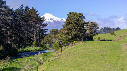 Naklejka na ściany i meble Picturesque landscape with snowcapped mount Taranaki