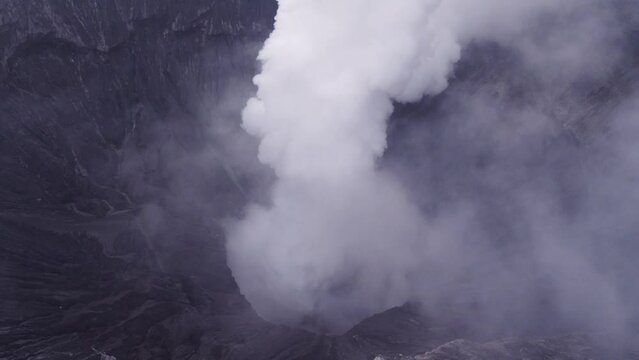 Flying backward at Mount bromo active volcano east java, aerial