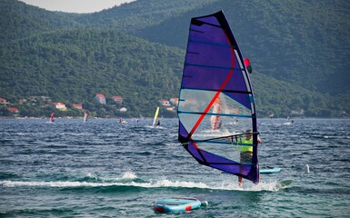 Windsurfer surfing on waves in Viganj on Peljesac peninsula, Croatia