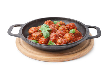 Frying pan of tasty meat balls with tomato sauce and basil on white background