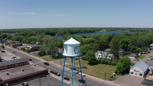 Reverse pullback aerial panning shot of the Swedish Coffee Pot Water Tower in Lindstrom, Minnesota. 4K