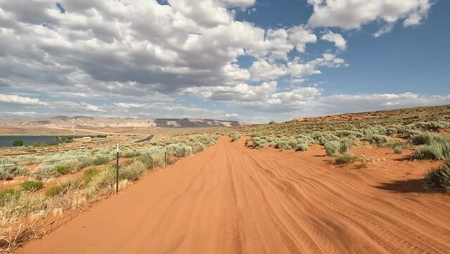 Off road trail riding sand and rocks UTV POV Utah. Southern Utah desert Sand Hollow. Red sandstone, dirt sand trails. Outdoor extreme 4x4 recreation ride and adventure. Recreation in nature.