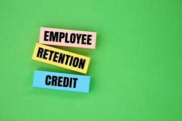 colored paper with the word Employee Retention Credit. the concept of employee salary retention