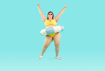 Happy confident fat woman having fun at beach party on summer vacation holiday. Plus size lady in...
