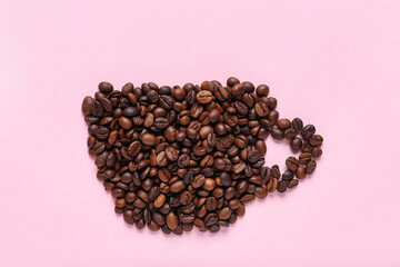 Cup of coffee made of beans on pink background