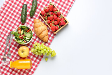 Bowl with salad, tasty food and juice for picnic on white background