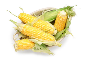 Wicker bowl with fresh corn cobs on white background