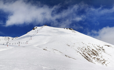 Fototapeta na wymiar Panorama of ski resort at sunny winter day
