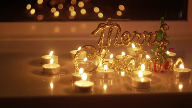 Candles and a Merry Christmas sign during holidays