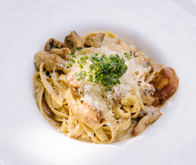 Delicious pasta with mushrooms and cheese in bowl