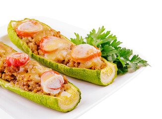Zucchini stuffed with meat, vegetables and cheese