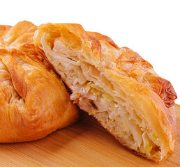 Baking puff pastry with fresh cabbage on wooden