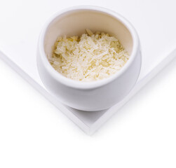 grated parmesan cheese in ceramic bowl