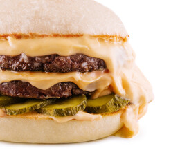 hamburger with two cutlets, pickled cucumbers and melted cheese