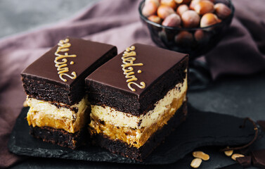 Fluffy snickers cake on stone board