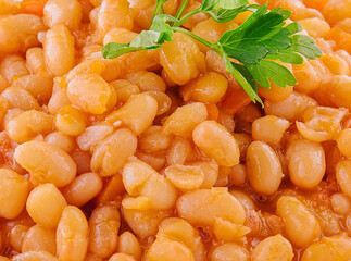 Boiled beans with tomato and spices close up