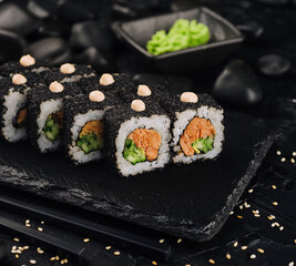 sushi rolls with fried tuna and black caviar