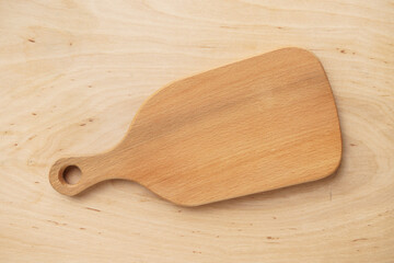 Kitchen cutting empty board on wooden table, top view