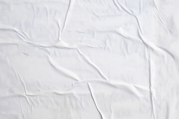 Naklejka premium white crumpled and creased paper poster texture background