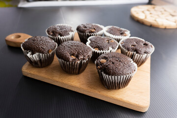 Chocolate muffins on a wooden board. Dessert. food concept. diet