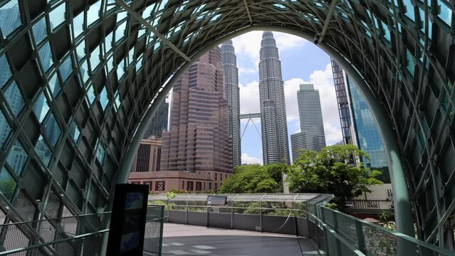 Kuala Lumpur, Malaysia - March 10, 2023: Scenic view from the Saloma Link footbridge to the Petronas Twin Towers in Kuala Lumpur.