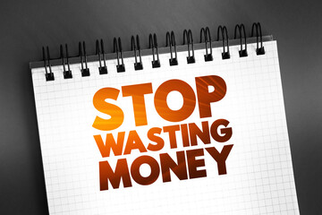 Stop Wasting Money text quote on notepad, concept background