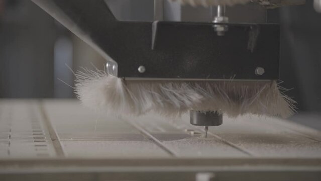 Close up of CNC machine cutting wood. 