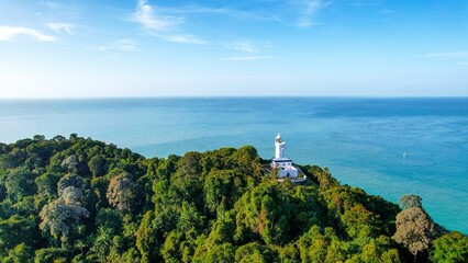 Aerial view of Tanjung tuan lighthouse on a lush green cliff in Malacca